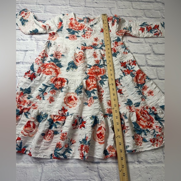 Franchesca’s Miami Little Girls Dress in White and Red Floral. Long
Sleeves. - Picture 4 of 7